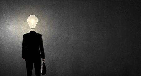 Businessman with light bulb instead of headの写真素材