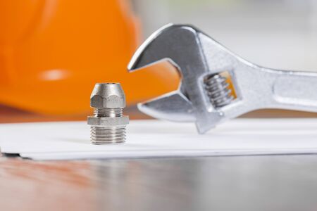 All kinds of plumbing and tools on sheet of paperの写真素材