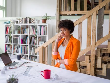Young female engineer working in officeの写真素材
