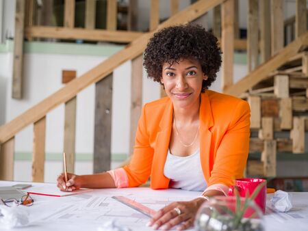 Young female engineer working in officeの写真素材