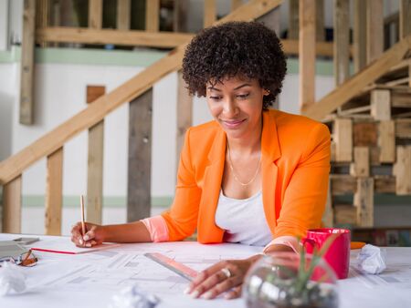 Young female engineer working in officeの写真素材