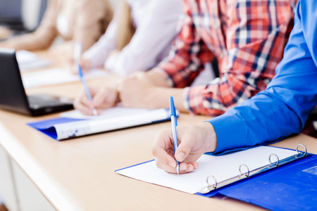 Young people sitting in classroom at lecture