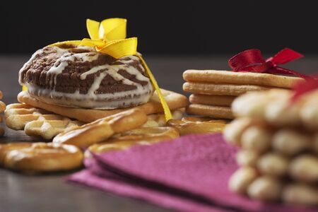 Stack of delicious cookies on napkin tied with ribbonの写真素材