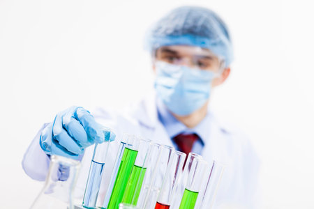 Young scientist making chemical tests in laboratory