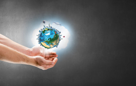Close up of hand holding Earth planet. 