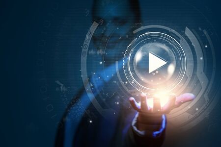 Close up of businesswoman pressing media play iconの写真素材