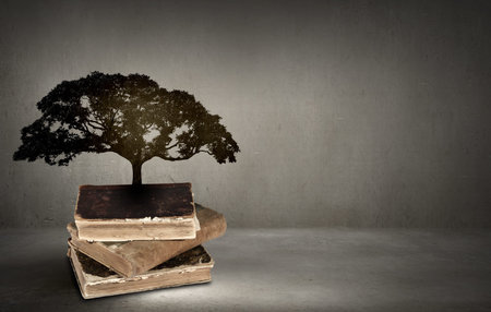 Concept of education and knowledge with tree growing from book