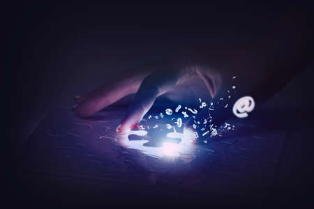 Close up of hands connecting puzzle element and making jigsaw completeの写真素材