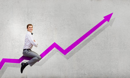 Concept of anti crisis with businessman that tames statistics diagramの写真素材