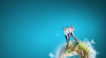 Businesspeople riding on back of their colleague