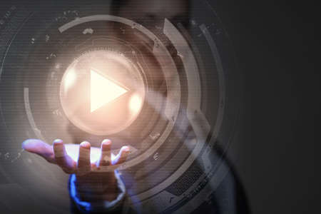 Businesswoman with media player button in palmの写真素材