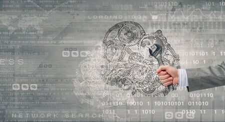 Close up of hand with wrench fixing mechanismの写真素材