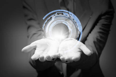 Businesswoman with media player button in palmの写真素材