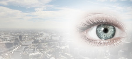 Bird eye view of modern city with human female eyeの写真素材