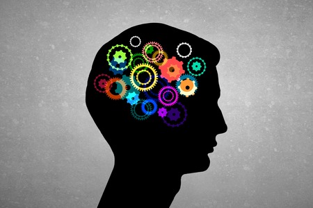 Silhouette of human head with gears instead of brainの写真素材