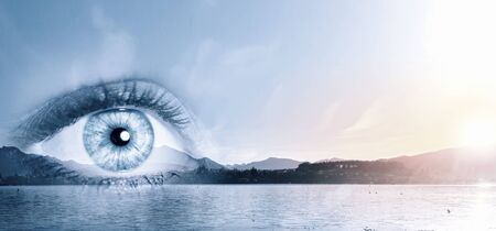 Panoramic view of scienic landscape and female eyeの写真素材