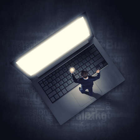 Top view of businessman with mobile phone in handの写真素材