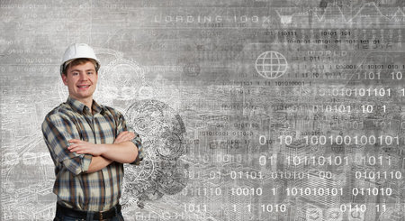 Portrait of happy mature architect in helmet standing with arms crossed on chest
