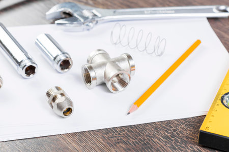 All kinds of plumbing and tools on white paper