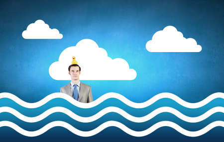 Funny businessman with yellow rubber duck toyの写真素材