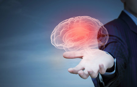 Close up of businessman holding human brain with working gears