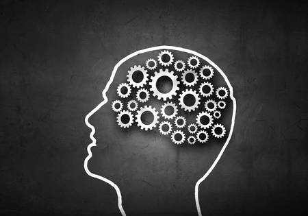Silhouette of human head with gears instead of brainの写真素材