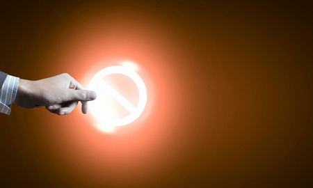 Close up of hand with stop media iconの写真素材