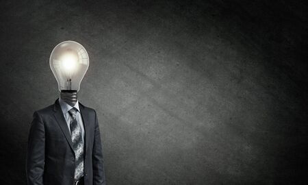 Idea concept with businessman and light bulb instead of his headの写真素材