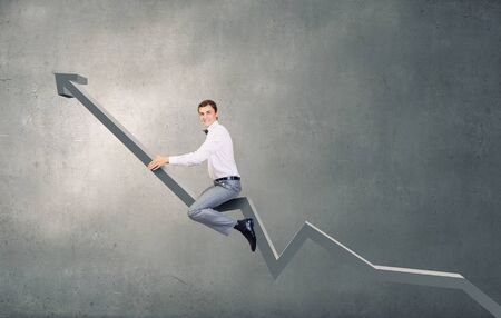 Concept of anti crisis with businessman that tames statistics diagramの写真素材