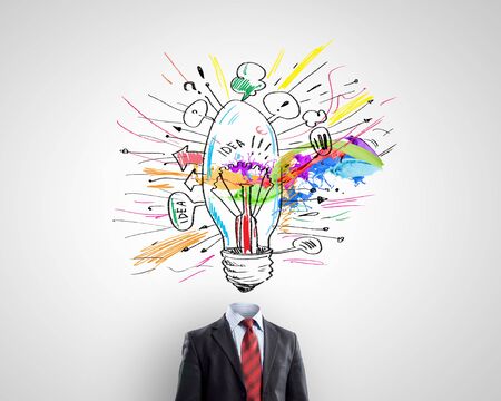 Idea concept with businessman and light bulb instead of his headの写真素材