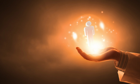 Close up of hand holding male figure iconの写真素材