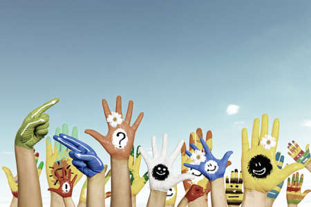 Image of human hands in colorful paint with smilesの写真素材