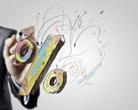 Close up of hand drawing percentage symbol with markerの写真素材