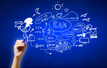 Close up of man hand drawing success strategy planの写真素材