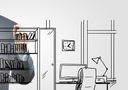 Close up of hand drawing office room with markerの写真素材