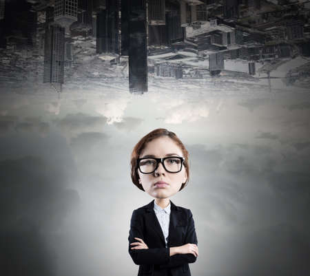 Funny young businesswoman with big head wearing glassesの写真素材