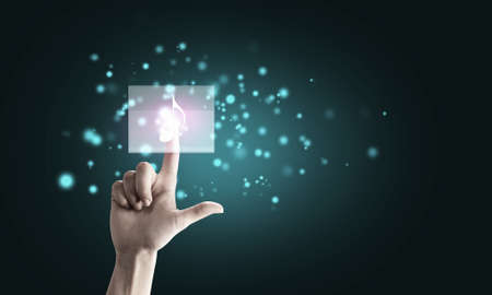 Close up of hand touching icon with fingerの写真素材