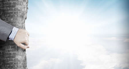 Close up of hand moving a part stone wallの写真素材