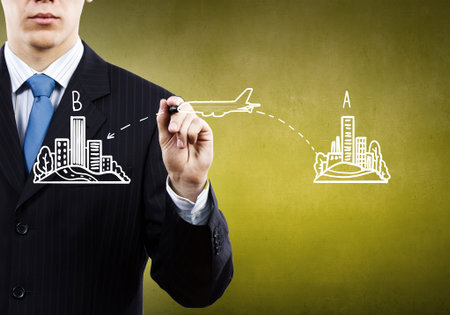 Close up of male hand drawing way from A to B pointの写真素材