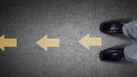 Top view of businessman legs choosing his wayの写真素材