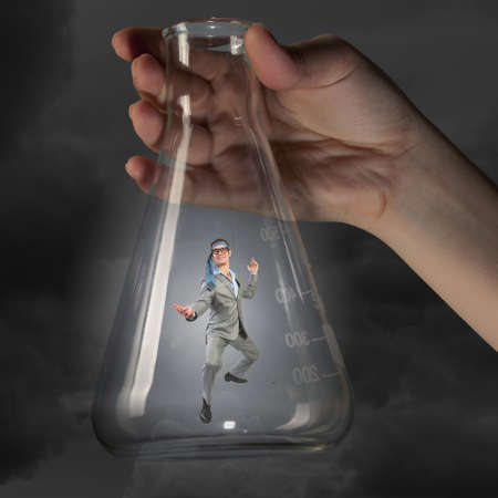 Cheerful young businessman with tie around headの写真素材