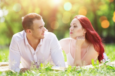 Young couple in love having fun and enjoying the beautiful natureの写真素材