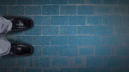 Top view of businessman legs choosing his wayの写真素材