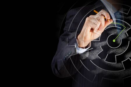 Close up of businessman drawing way out of labyrinthの写真素材