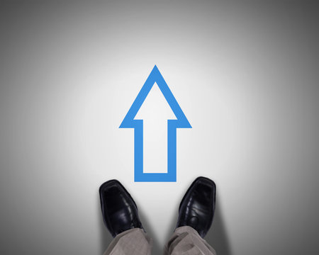 Top view of businessman legs choosing his way