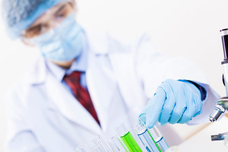 Young scientist making chemical tests in laboratory