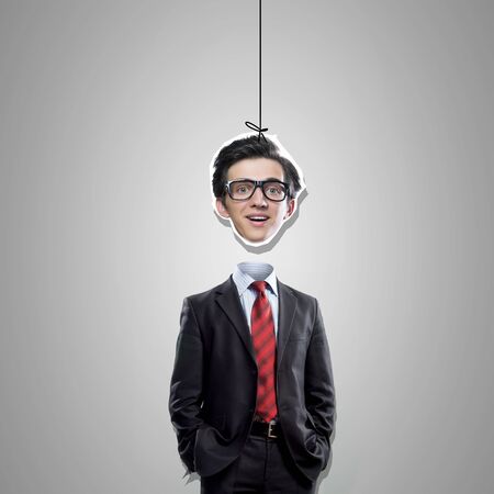 Funny businessman and his head hanging on ropeの写真素材