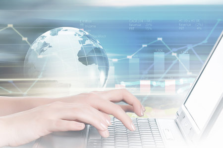 Hands of businessman running with fingers on laptop keyboard