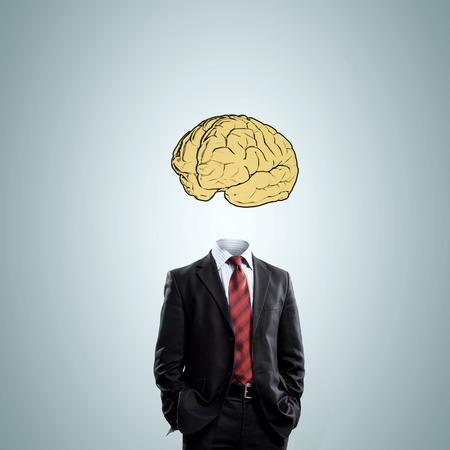 Businessman in suit with brain instead of headの写真素材
