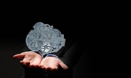 Close up of human hand holding gears engineの写真素材
